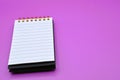 purple background with empty notebook Royalty Free Stock Photo