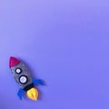 Purple Background with Handmade Felt Rocket Toy