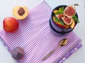 Purple background. Healthy eating concept. Fruit salad with fresh fruits. Copy space for your text. Selective focus. Royalty Free Stock Photo