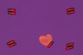 Purple background with pills and a small red heart. Epilepsy Day. Royalty Free Stock Photo