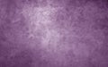 Purple background with texture. Soft shiny purple with mottled marbled old vintage grunge texture. Distressed weathered old faded
