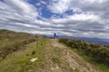 Purple big bench in the inland of Genoa in the countryside under a cloudy sky, Italy Royalty Free Stock Photo