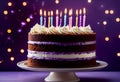 Purple birthday celebration layer cake with white frosting Royalty Free Stock Photo