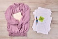 Purple blouse with notepad and work papers with statistics. Royalty Free Stock Photo