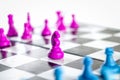 Purple and blue Knight fighting in a chessboard Royalty Free Stock Photo