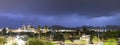 Purple Blue light illuminates the sky over the buildings homes and hills around Tucson Arizona Royalty Free Stock Photo