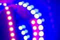 Purple blue neon bokeh lights. Abstract background of 80s colors Royalty Free Stock Photo
