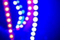 Purple blue neon bokeh lights and reflections. Festive Abstract background of 80s colors Royalty Free Stock Photo