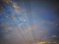 Purple blue sky, electric wire cable or power lines during the late afternoon towards the evening Royalty Free Stock Photo