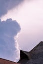 Cloud sky texture with straw hut building