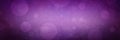 Purple bokeh lights background with soft blurred out of focus circles and dark black vignette border with bright center, magical g Royalty Free Stock Photo