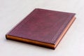 Purple book with gold pages on the gray background Royalty Free Stock Photo