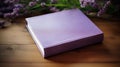 Purple Book With Lavender Flowers On Wooden Table