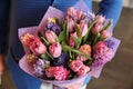 Purple bouquet of tulips and irises in the hands Royalty Free Stock Photo