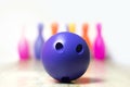 purple bowling ball is clearly placed in front. on a background with pins lined up Wait for the players to throw them all down Royalty Free Stock Photo