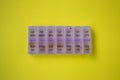 Purple box, container or organizer for pills for each day of the week, daily capsule box, health care concept Royalty Free Stock Photo