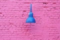 Purple brick wall with metallic lamp Royalty Free Stock Photo