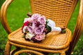 Purple bridal bouquet on a chair