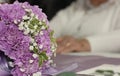 Purple Bridal Bouquet With Elderly Bride in Background, Shallow DOF
