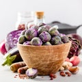 Purple Brussels sprouts in a wooden bowl Royalty Free Stock Photo