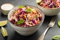 Purple cabbage and carrot salad with mayonnaise in a white bowl on a black background. Classic coleslaw. Diet vegetarian dish