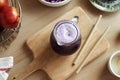 Purple cabbage juice in a jug with bamboo straws Royalty Free Stock Photo