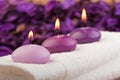 Purple candles on massage towel (1)