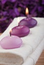 Purple candles on massage towel (2)