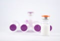 Purple cap injection vial show medicine concept Royalty Free Stock Photo