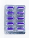 Purple capsule in transparent blister pack