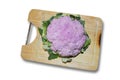 Purple cauliflower on wood chopping board