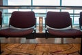 Purple chairs with free standard USB power socket or USB port slot charger in airport. Travelling comfort