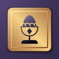 Purple Chicken egg on a stand icon isolated on purple background. Gold square button. Vector