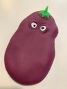 Purple children squishy pear toy with white eyes