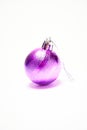 Purple Christmas ball on a white background, New Year, Christmas toys, holiday, Christmas. Royalty Free Stock Photo