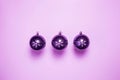 Purple Christmas ornament, christmas balls in a row near purple background, retro design Royalty Free Stock Photo