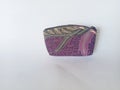 Purple clutch made from leaf batik patterned fabric