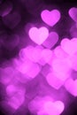 Purple color heart bokeh background photo. Abstract holiday, celebration backdrop. Royalty Free Stock Photo