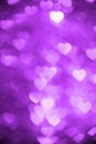 Purple color heart bokeh background photo. Abstract holiday, celebration backdrop. Royalty Free Stock Photo