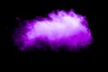 Purple color powder explosion cloud on black background.Closeup of purple dust particles splash  on  background Royalty Free Stock Photo