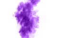 Purple color powder explosion cloud  on white background.Closeup of purple dust particles splash on background Royalty Free Stock Photo