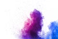 Purple color powder explosion cloud  on white background.Closeup of purple dust particles splash on background Royalty Free Stock Photo