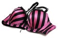 A purple colored padded brassiere with black stripes, laces and straps Royalty Free Stock Photo