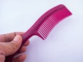 The purple comb is usually used to straighten hair Royalty Free Stock Photo