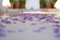 Purple confetti on table Royalty Free Stock Photo