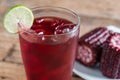 Purple corn juice wood table background Royalty Free Stock Photo