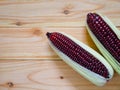 Purple corn or purple maize on wooden background Royalty Free Stock Photo