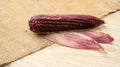 Purple corn on a wooden table Royalty Free Stock Photo