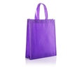 Purple cotton bag. Studio shot isolated on white