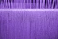 Purple cotton yarn on loom
